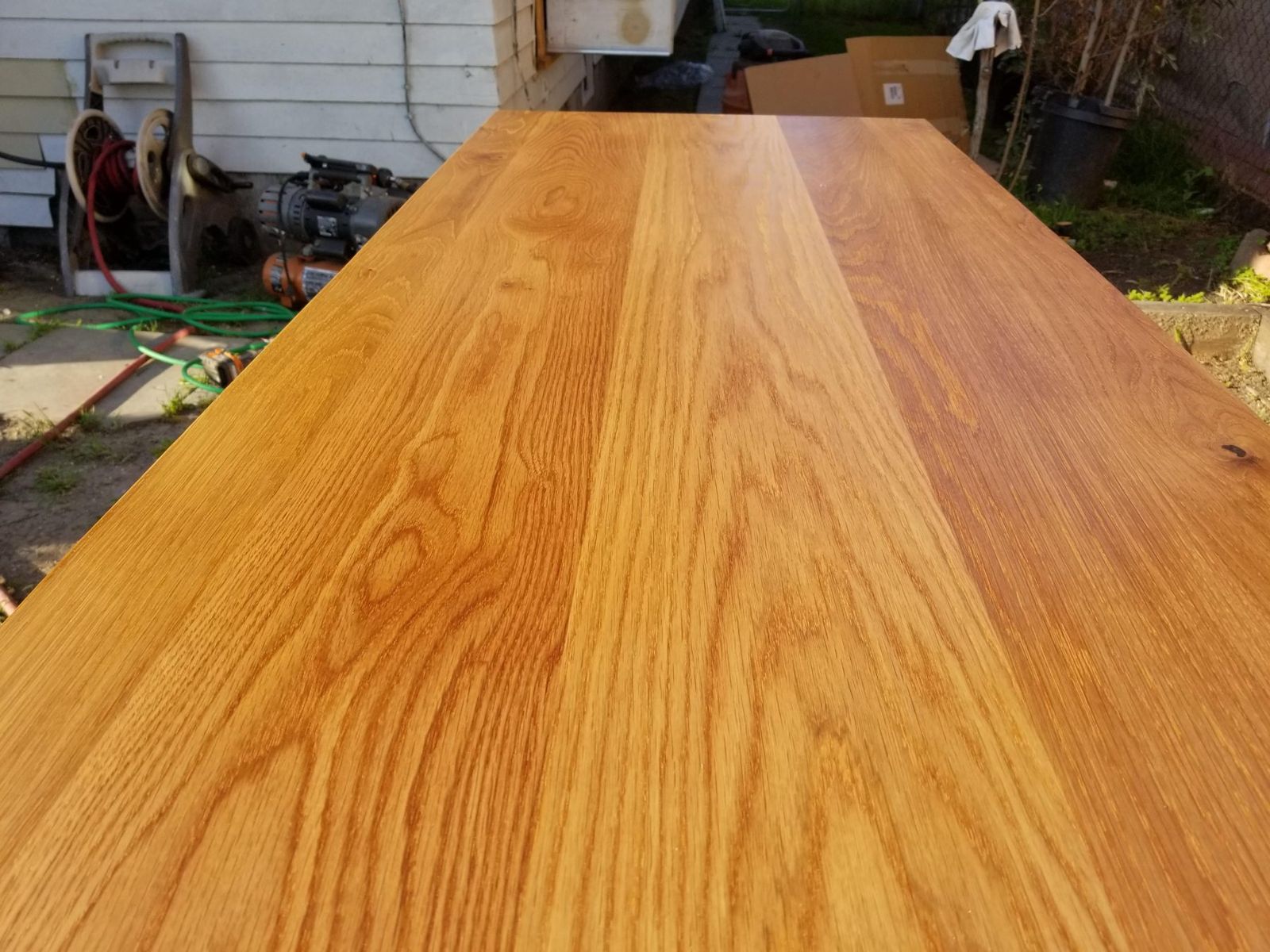Close view of a solid wood countertop with rich grain
