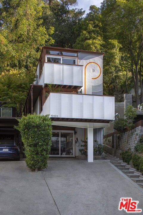 Front of the home with its supergraphic and white guardrails