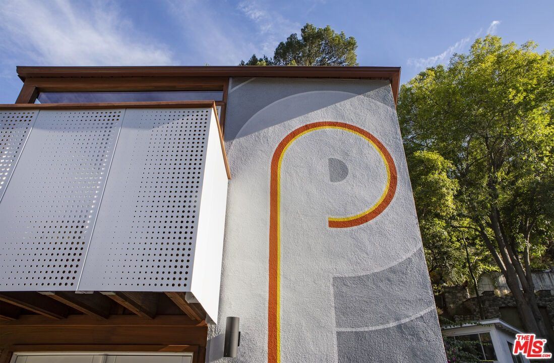 Supergraphic facade and perforated aluminum guardrail