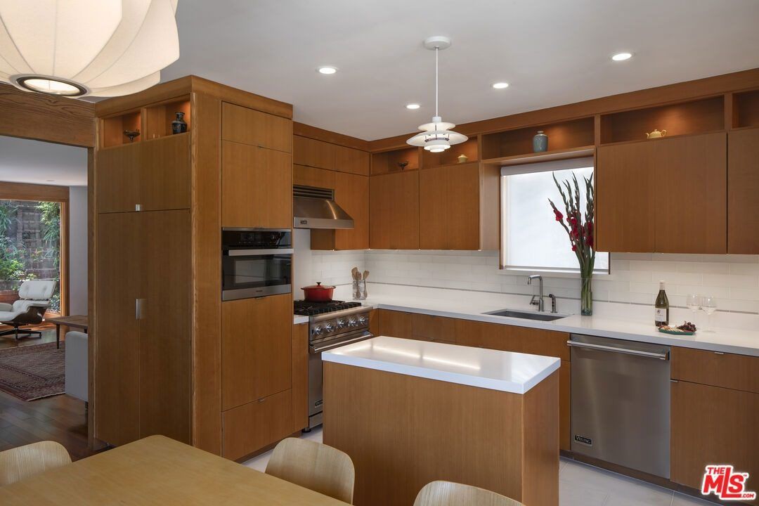 Kitchen with warm wood cabinetry and a center island