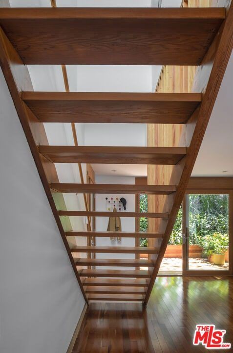 View up through the open wood stair treads